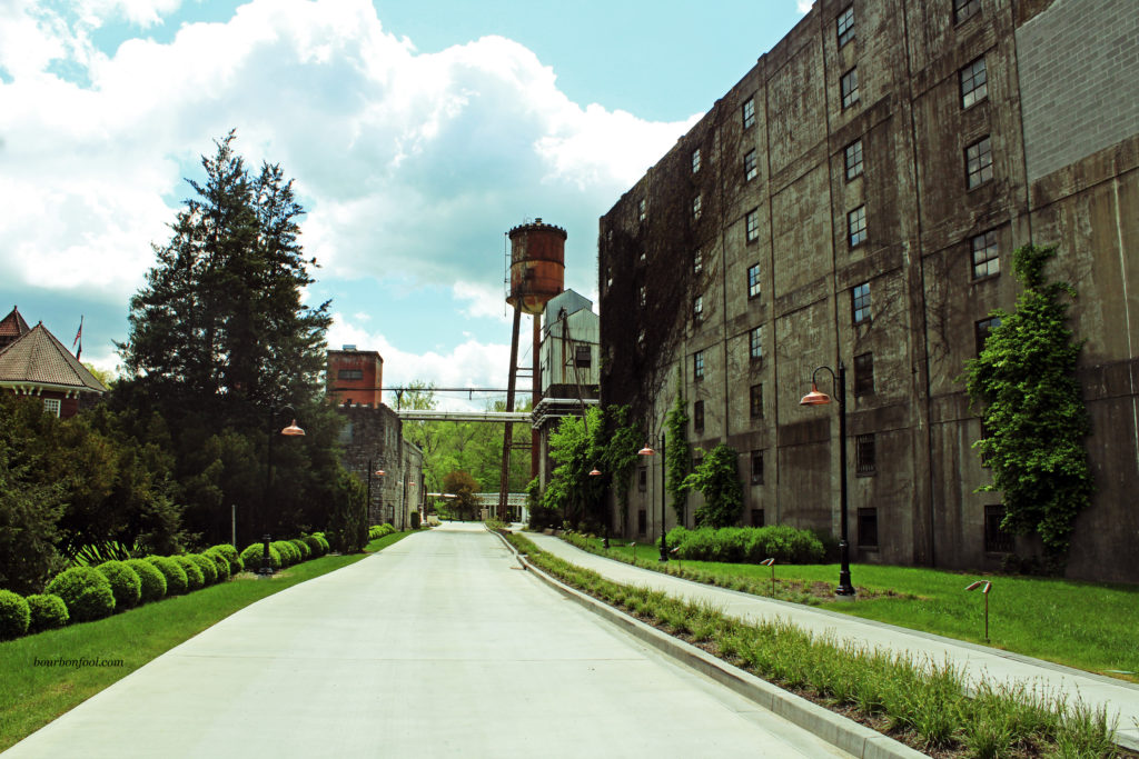 Castle & Key Distillery grounds water tower and aging warehouse