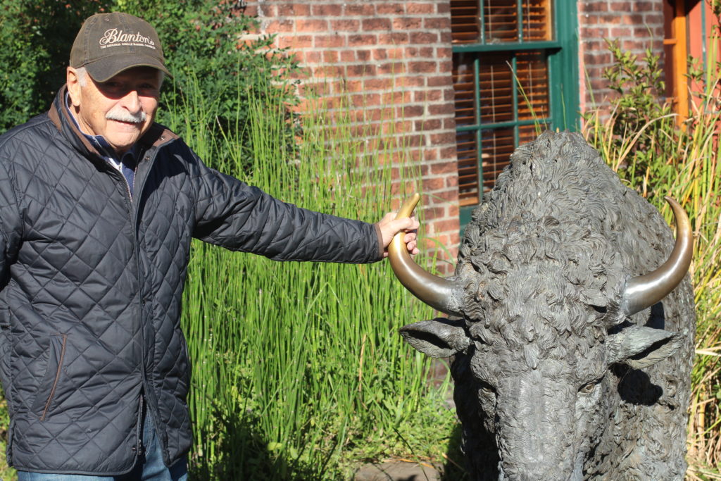 Larry at Buffalo statue outside of Buffalo Trace Distillery