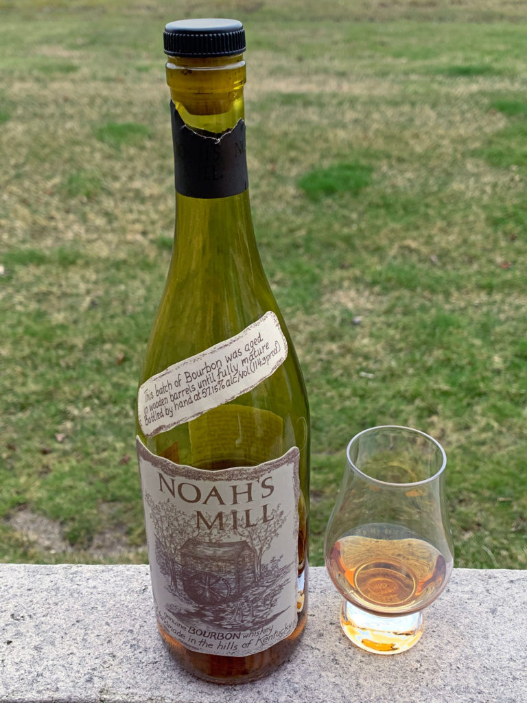 A bottle and glass of Noah's Mill Bourbon One of ten everyone should have